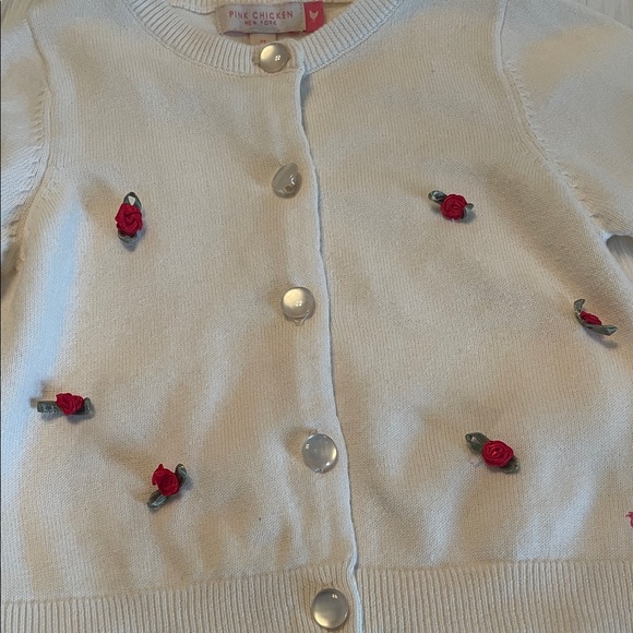 Pink Chicken Toddler Girl’s Cream Cardigan with Red Rosettes - Picture 4 of 7